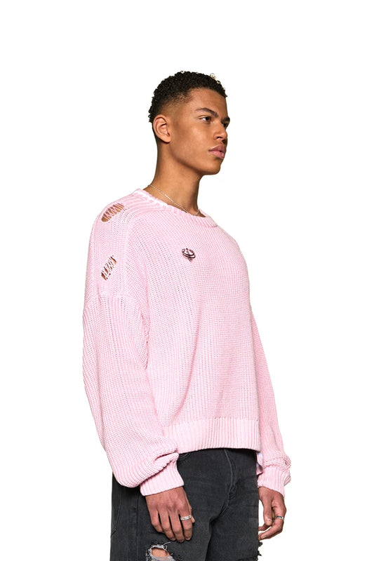 Man in Distressed Knit Sweater Pink, oversized and unisex, with offset collar and detachable OLAKALA Defect Identity Icon Pin.