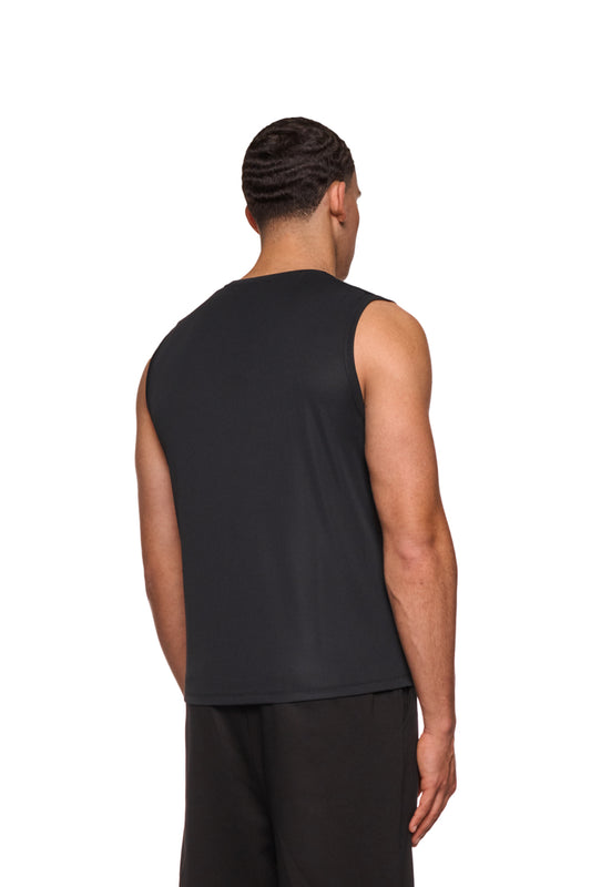 Man wears the Sports Function Tanktop Black, emphasizes shoulders and back, ideal for sports; made of antibacterial synthetic fiber with OLAKALA logo on the chest.