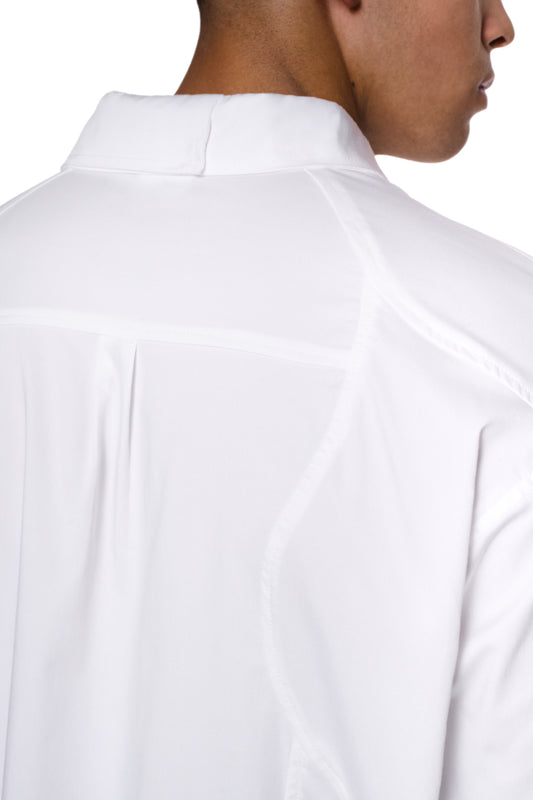 CC Anatomy Shirt White by OLAKALA, back view: loose fit, double-layer collar, dividing seams, breast pocket with embroidered logo, cuffs with buttons.