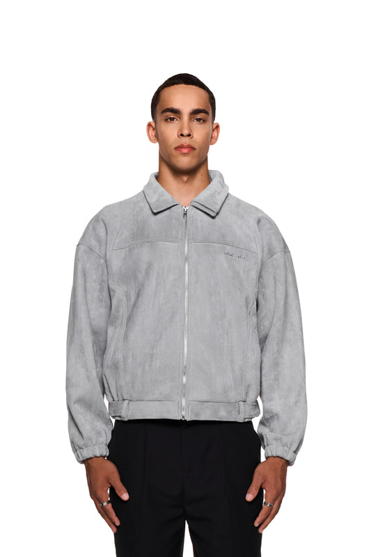 Man wears CC Anatomy Velour Jacket Light Gray with double-layer collar and metal zipper, loose fit.