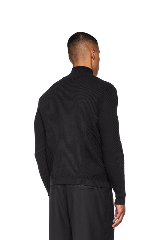 Man with CI Slim Knit Jacket in black, slim fit, knitted pattern, zipper front, unisex, seen from behind.