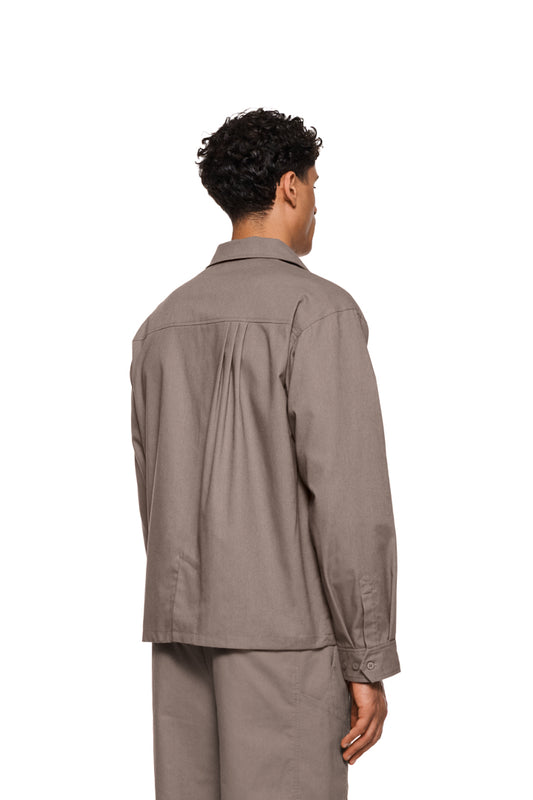 Sun Linen blazer with asymmetric safari collar, removable shoulder padding and pleat details, regular fit, with shirt button placket and cufflinks, by OLAKALA.