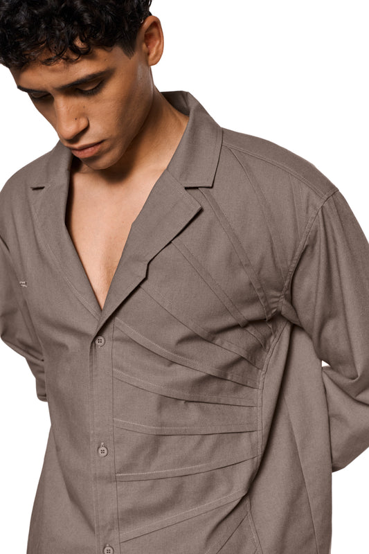 Sun Linen blazer with lightweight, breathable fabric, asymmetrical safari collar, removable shoulder padding and shirt button placket; unisex design by OLAKALA.