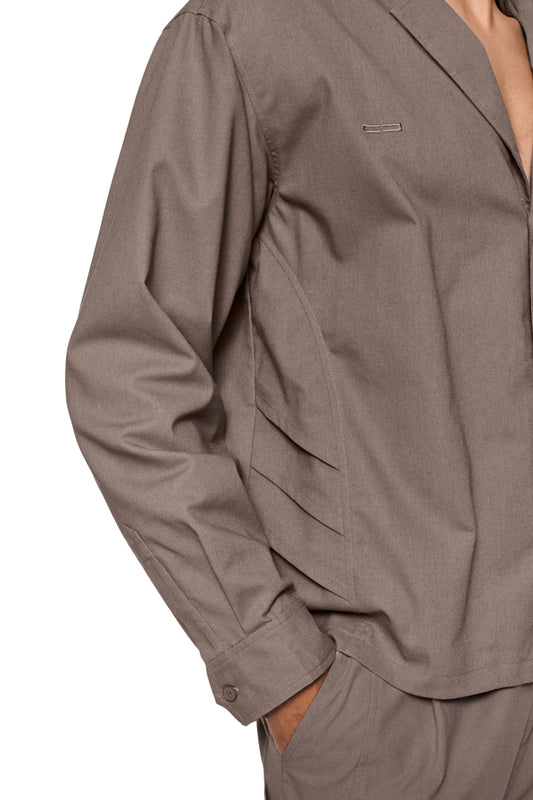 Unisex sun linen blazer with asymmetric safari collar, removable shoulder padding, shirt button placket and sun detail at the front, regular fit, three buttons at the cuffs.