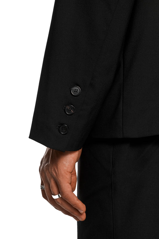 Asymmetric layered blazer with double-layered side, removable shoulder padding, asymmetric lapel collar and several flap pockets, matching the unisex collection by OLAKALA.