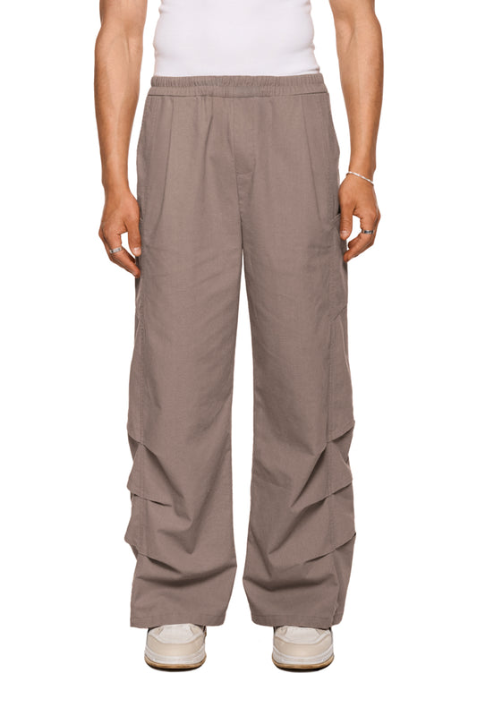 Leinen Gills Dress Pants mit elastischem Bund, französischen Taschen, Kiemenoptik-Lufteinlässen und Logo-Stickerei, bieten eine lockere, unisex Passform. Ideal für OLAKALA® Stil.