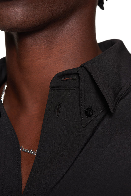 CC Button Shirt Black with double collar, chest pocket with metal logo, dividing seams, oversized fit. Unisex design, detailed collar and buttons.