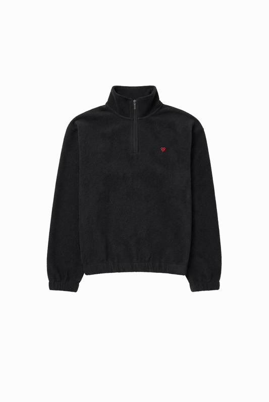 Black Heart Fleece Half-Zip with a quarter-length zipper, elastic cuffs, and a heart logo on the chest. Simple design made from soft, insulating fabric.