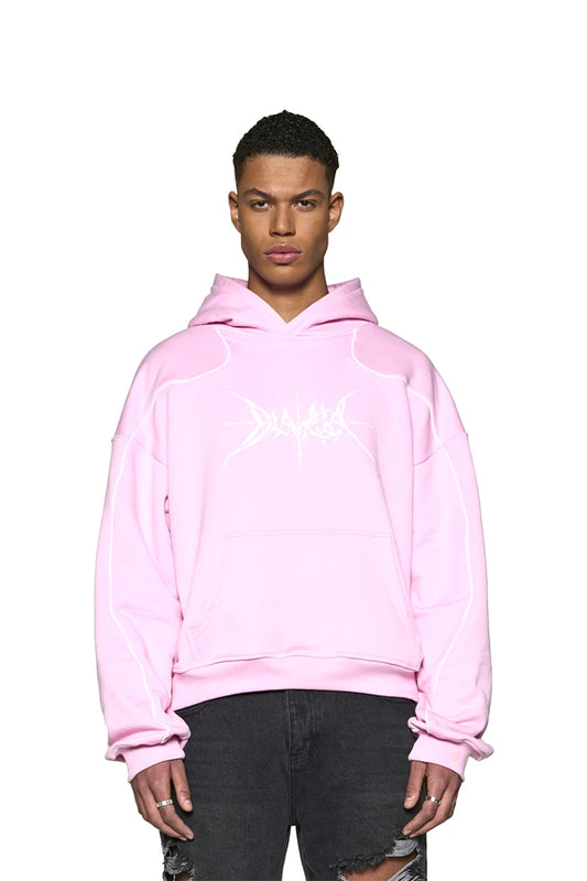 Mann trägt Defect ID Hoodie Pink mit Siebdruck-Grafik auf der Brust, oversized und cropped Fit, unisex Design.