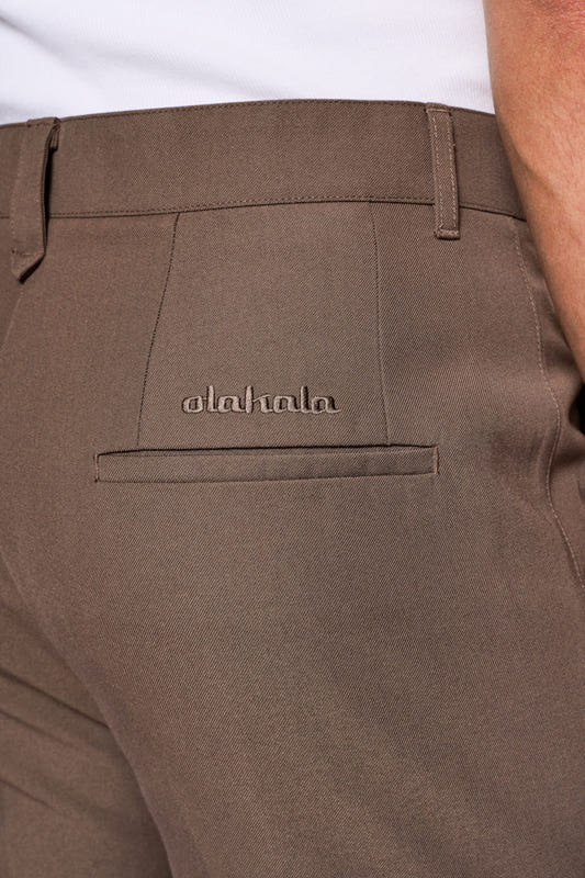 CC Dress Pants Slim Fit Brown with asymmetric pocket, piped pockets at the back, pleats at the front and OLAKALA logo above the back pocket, in soft twill fabric.