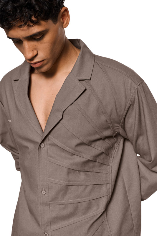 Sun Linen blazer with lightweight, breathable fabric, asymmetrical safari collar, removable shoulder padding and shirt button placket; unisex design by OLAKALA.