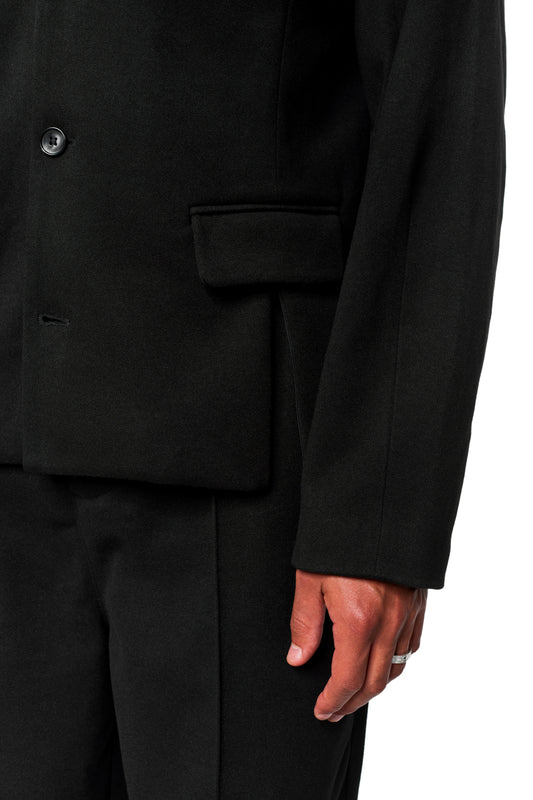 Straps in Exquisite Blazer Black with asymmetrical lapel, visible button, flap pocket, silver ring; unisex fit with stylish details for the OLAKALA® look.