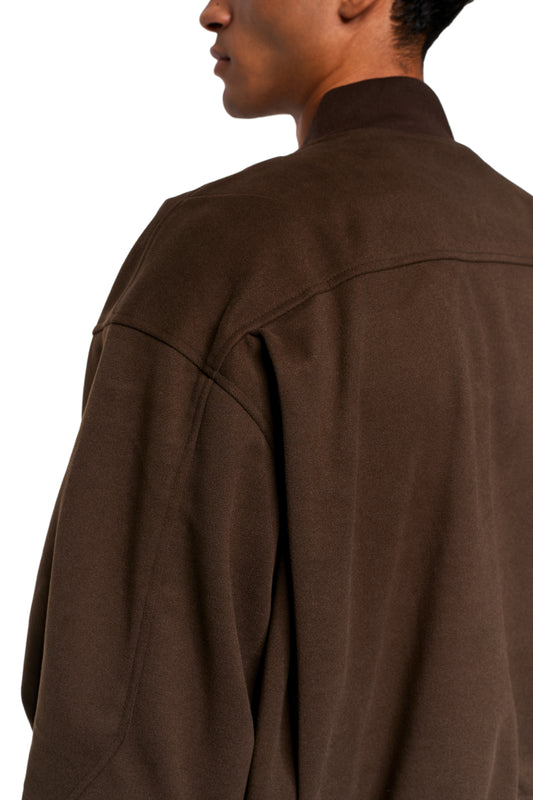 Exquisite Bomber Jacket Brown with stand-up collar, visible seams and embroidered OLAKALA icon, emphasized by dart details and loose fit.