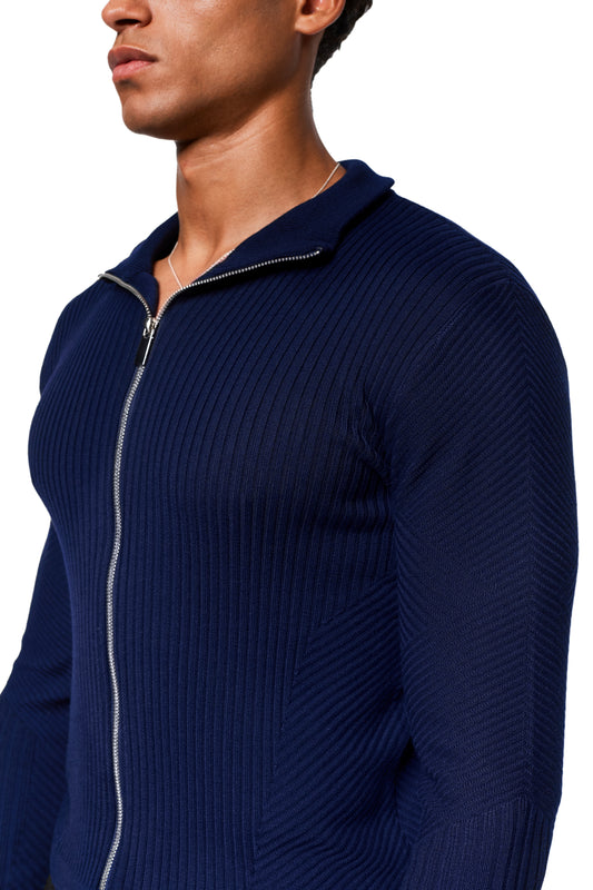 Exquisite Knit Jacket Navy Blue with body-hugging knit pattern, stand-up collar and silver zipper. Knitted cuffs emphasize the close-fitting unisex fit.