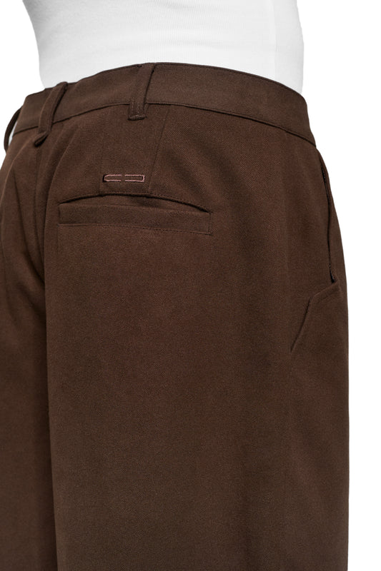 Exquisite Dress Pants Brown: unisex trousers with pleats, offset side seam, seamless zipper at the hem, embroidered OLAKALA icon and loose fit.