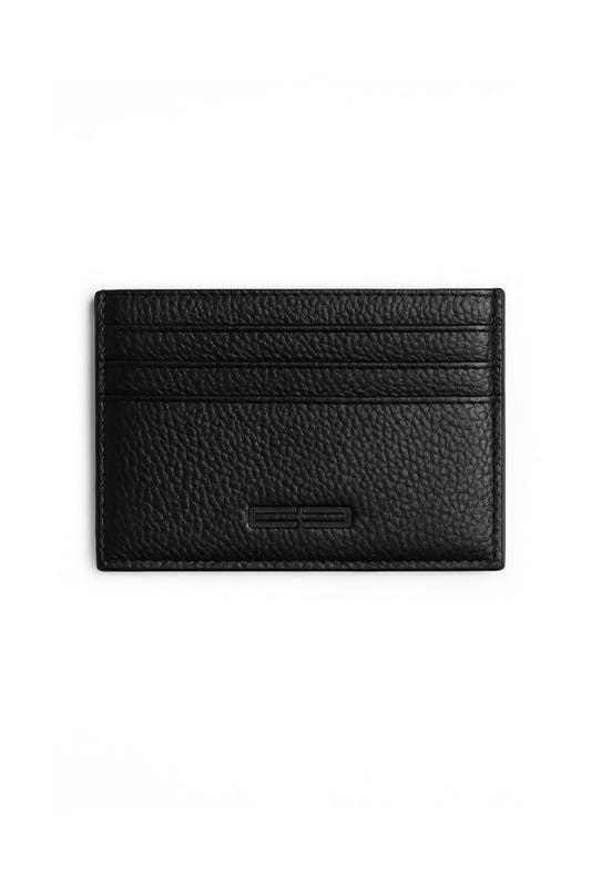 CC Icon Cardholder made of textured black leather with three card slots and a larger compartment, featuring a subtle embossed logo at the bottom. Photographed against a white background.