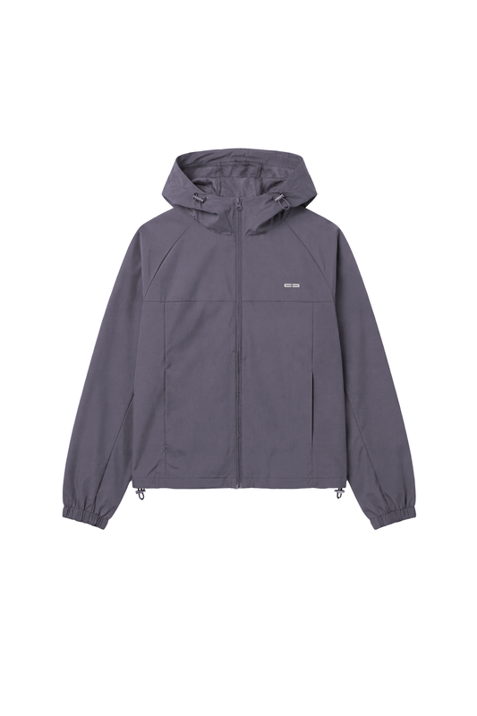 Charcoal-grauer Windbreaker Icon Gray mit verstellbarer Kapuze, elastischen Bündchen und kleinem Logo, ideal für Sport und Alltagsaktivitäten.