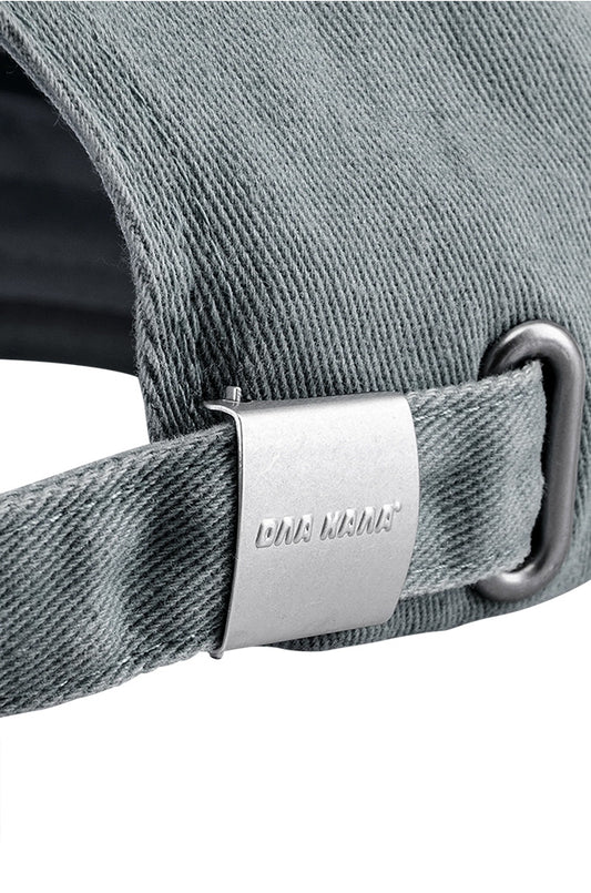 Rhodes cap gray with adjustable metal clip and embroidered OLAKALA logo, close-up of the hat with visible metal buckle.