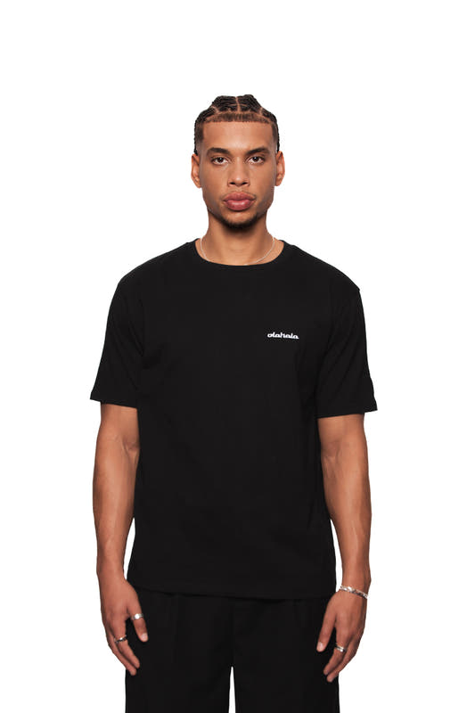 NC T-Shirt Black Regular, unisex, with OLA KALA Neighbor's Cherries graphic on the back and embroidered logo on the left chest. European production.